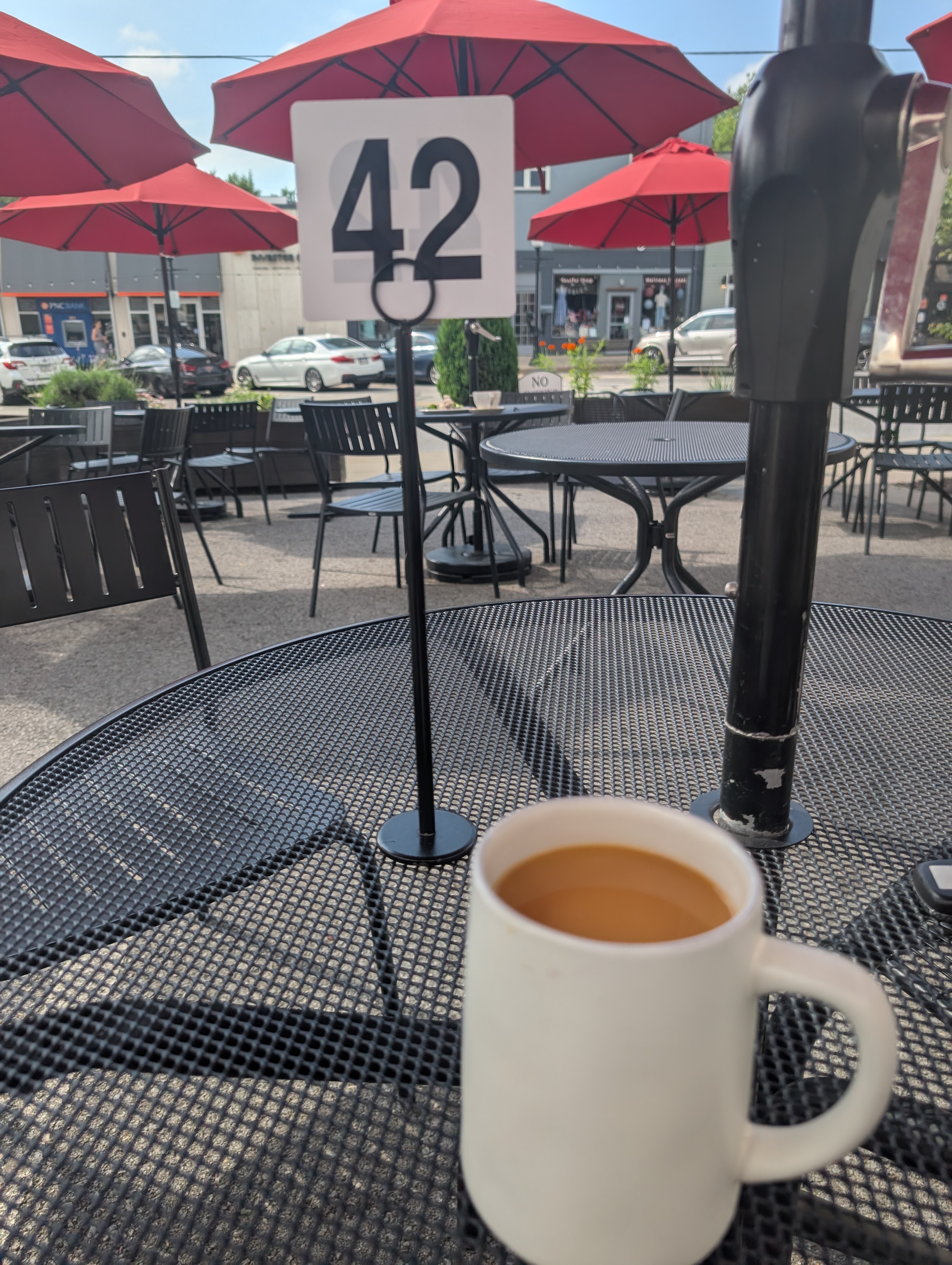 Cup of coffee with a "42" placard for my food behind it